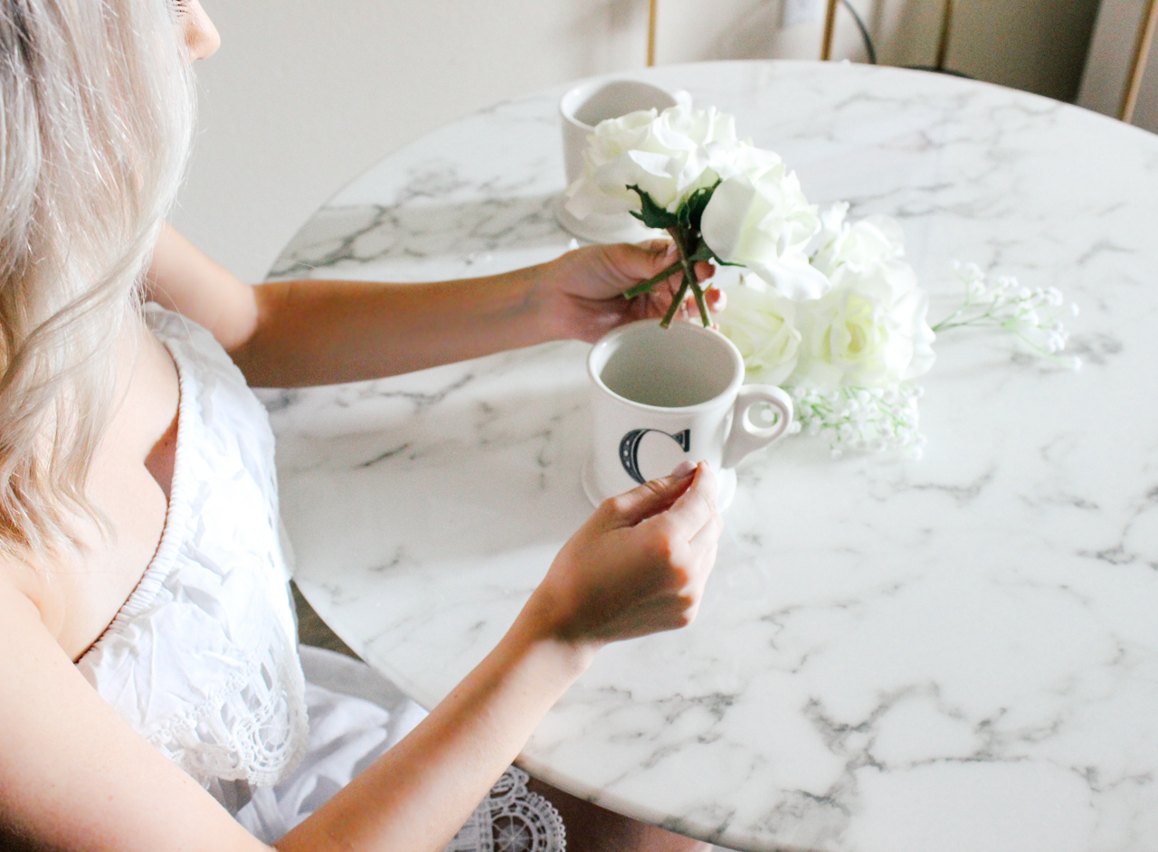 DIY Decor: Coffee cup filled with flowers | StyledByBlondie.com