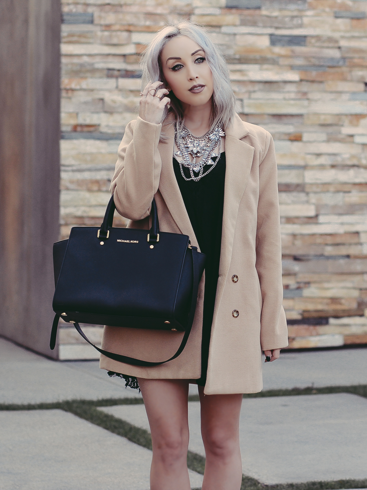 Camel Trench Coat, Black Babydoll Dress, Statement Necklace by @happinessbtq | BlondieintheCity.com