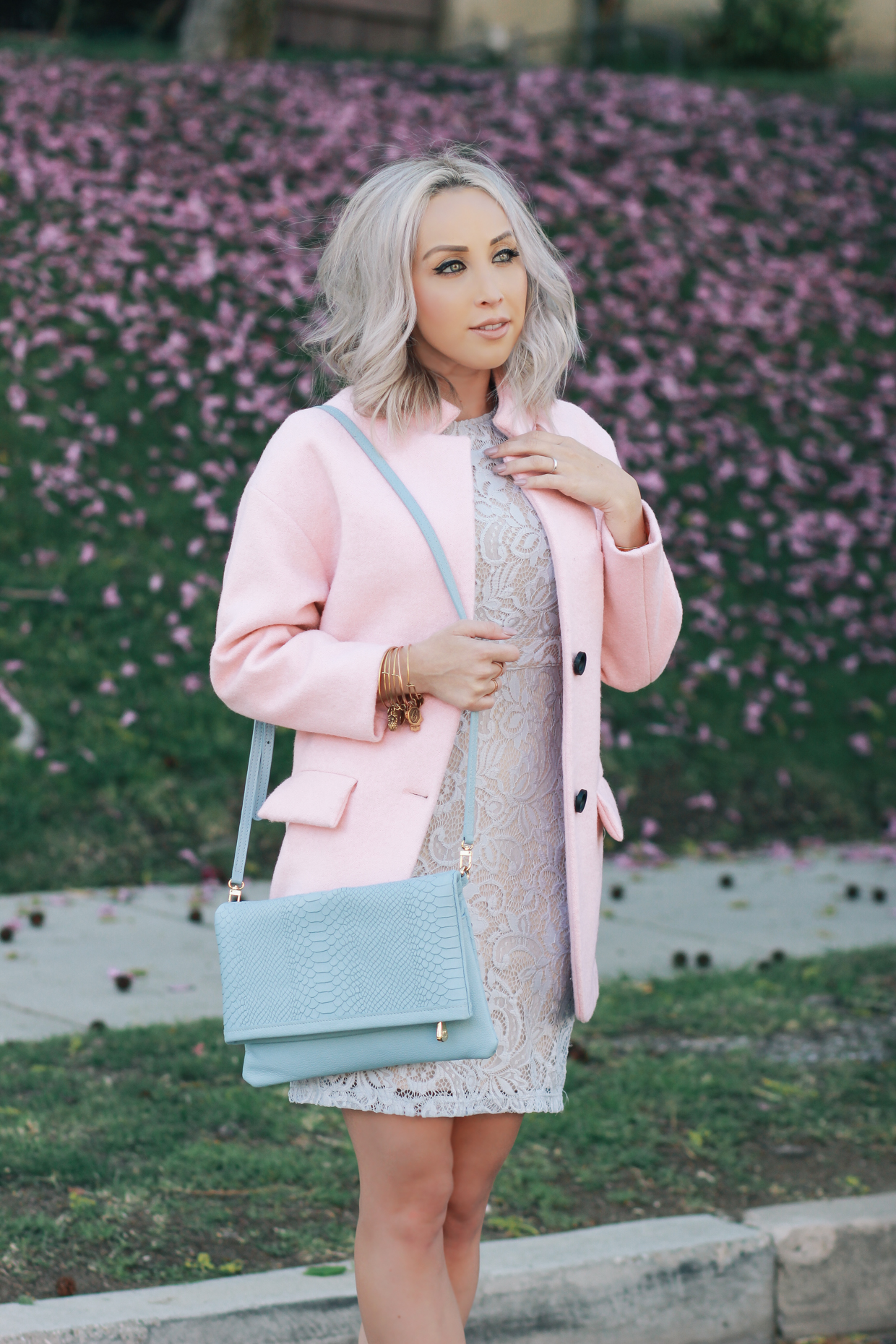 Blondie in the City | Pastel Spring Outfit | Blue Lace Dress, Pink Coat, Christian Louboutin's, & Reversible Python Clutch by @giginewyork