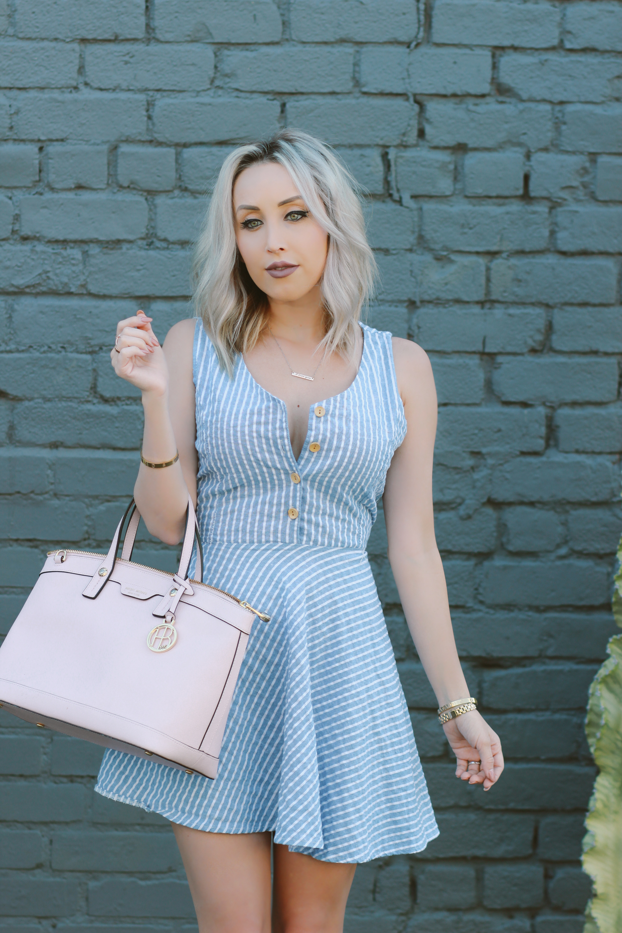 Blondie in the City | Striped blue and white dress, button up | Pink Henri Bendel Bag, Pink Christian Louboutin's