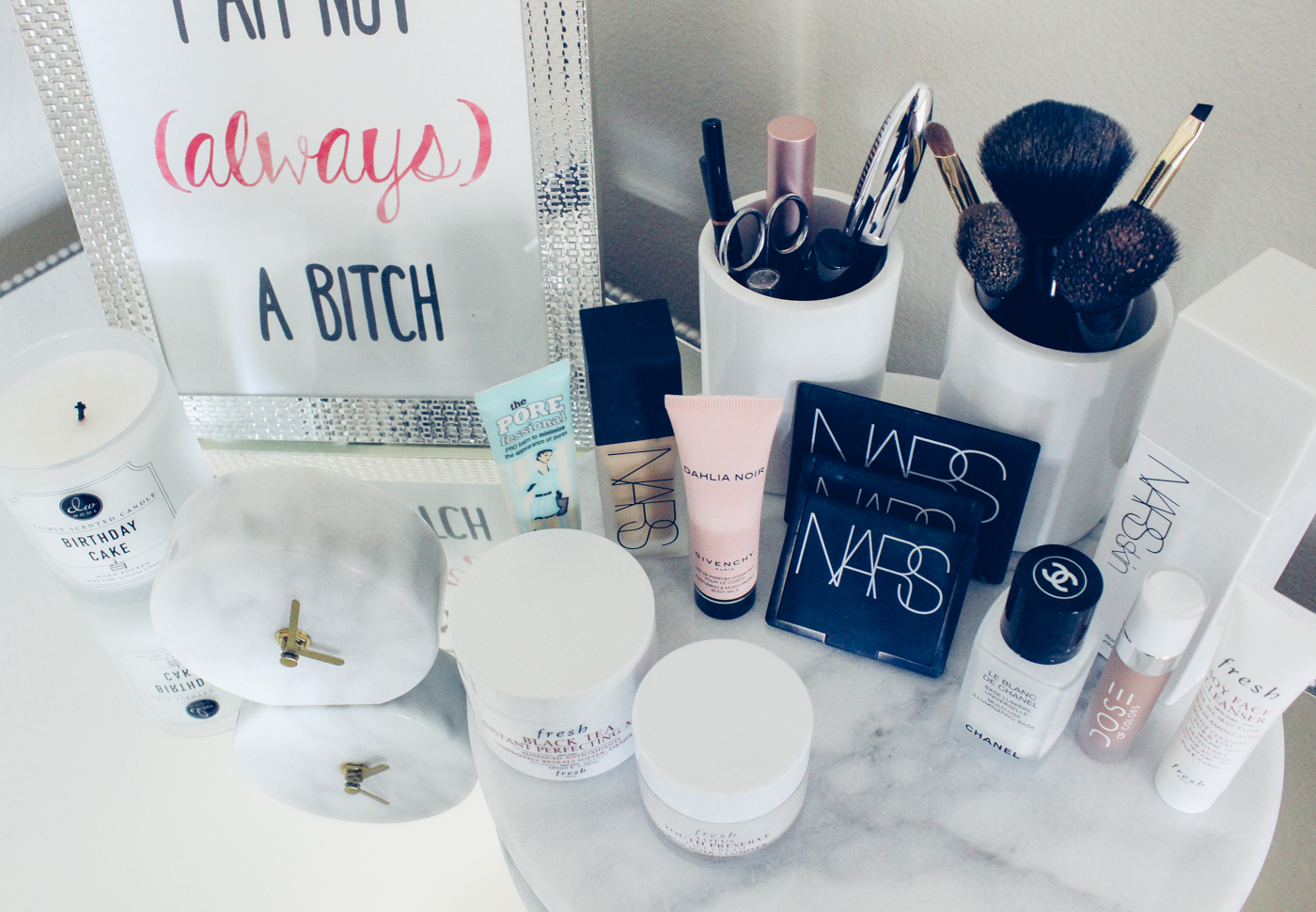 Blondie in the City | Marble Bathroom Styling | Makeup Products, NARS Makeup | Chanel Makeup | Black and White Bathroom Decor | White Marble Clock | White Marble Lazy Susan