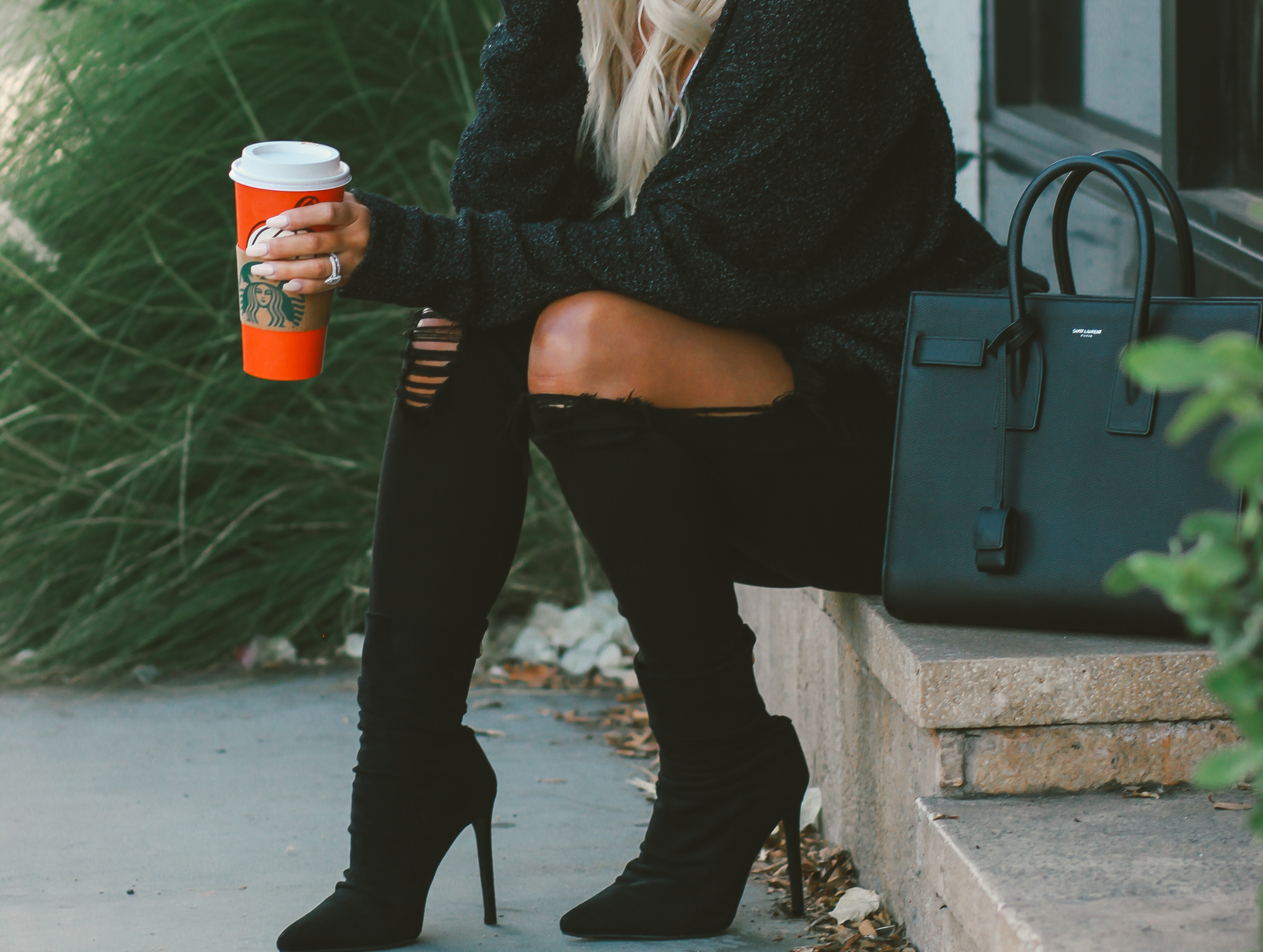 Blondie in the City | White bodysuit, black distressed jeans, black boots, black YSL Bag