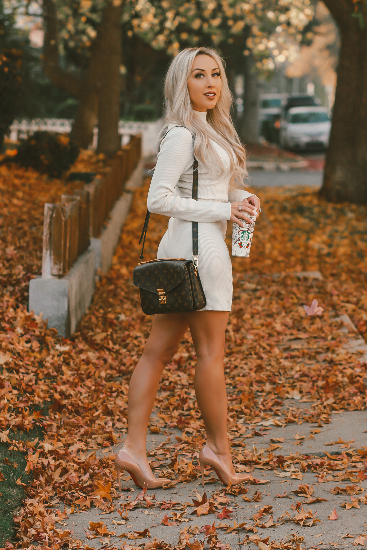 Blondie in the City | Cozy White Sweater Dress | Fall Fashion | Louis Vuitton | Fall Leaves | Louboutin's