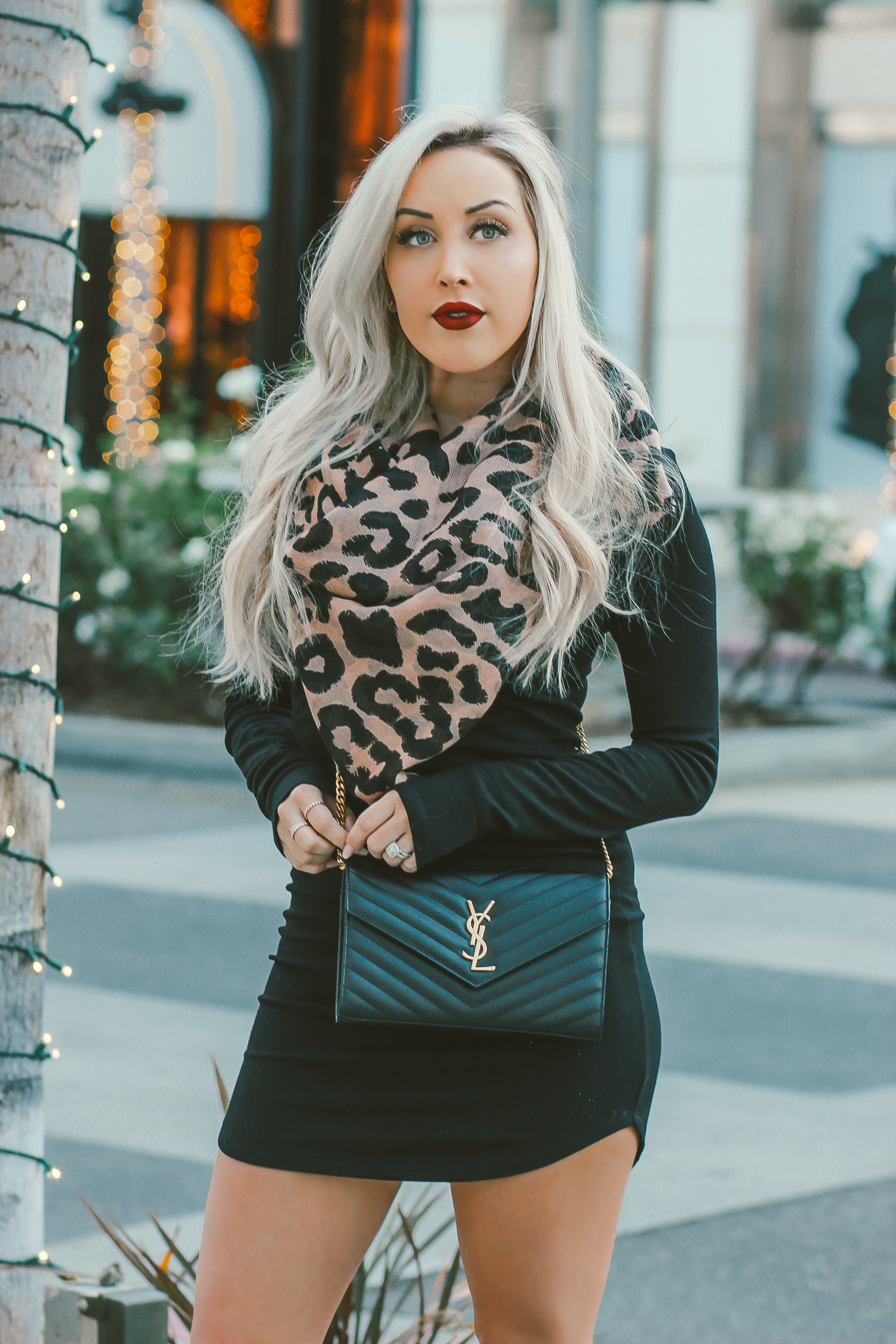Blondie in the City | Black Sweater Dress, Leopard Scarf | Black Faux Fur Loafers | Black YSL Bag
