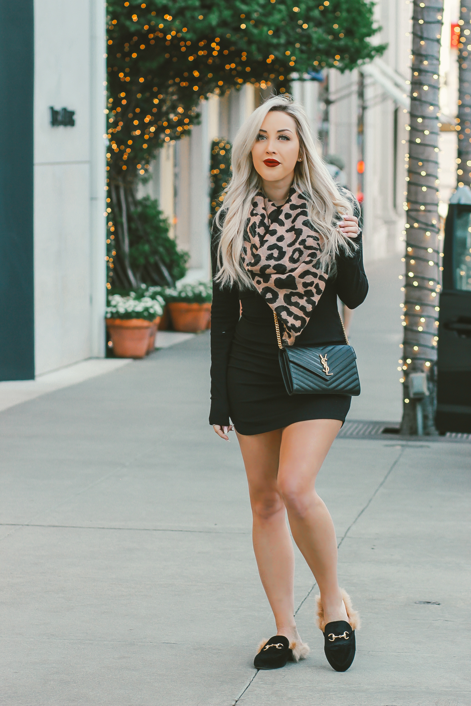 Blondie in the City | Black Sweater Dress, Leopard Scarf | Black Faux Fur Loafers | Black YSL Bag