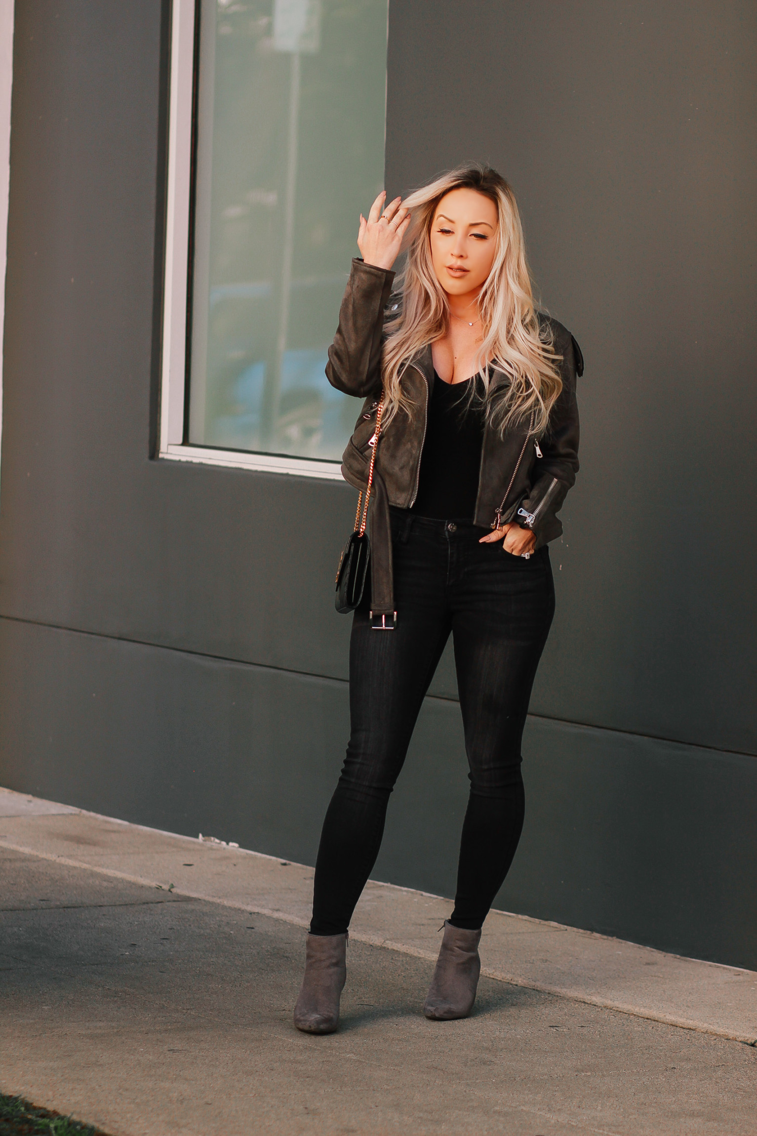 Suede Jacket, Black Bodysuit, Black Denim, YSL Bag | Blondie in the City by Hayley Larue