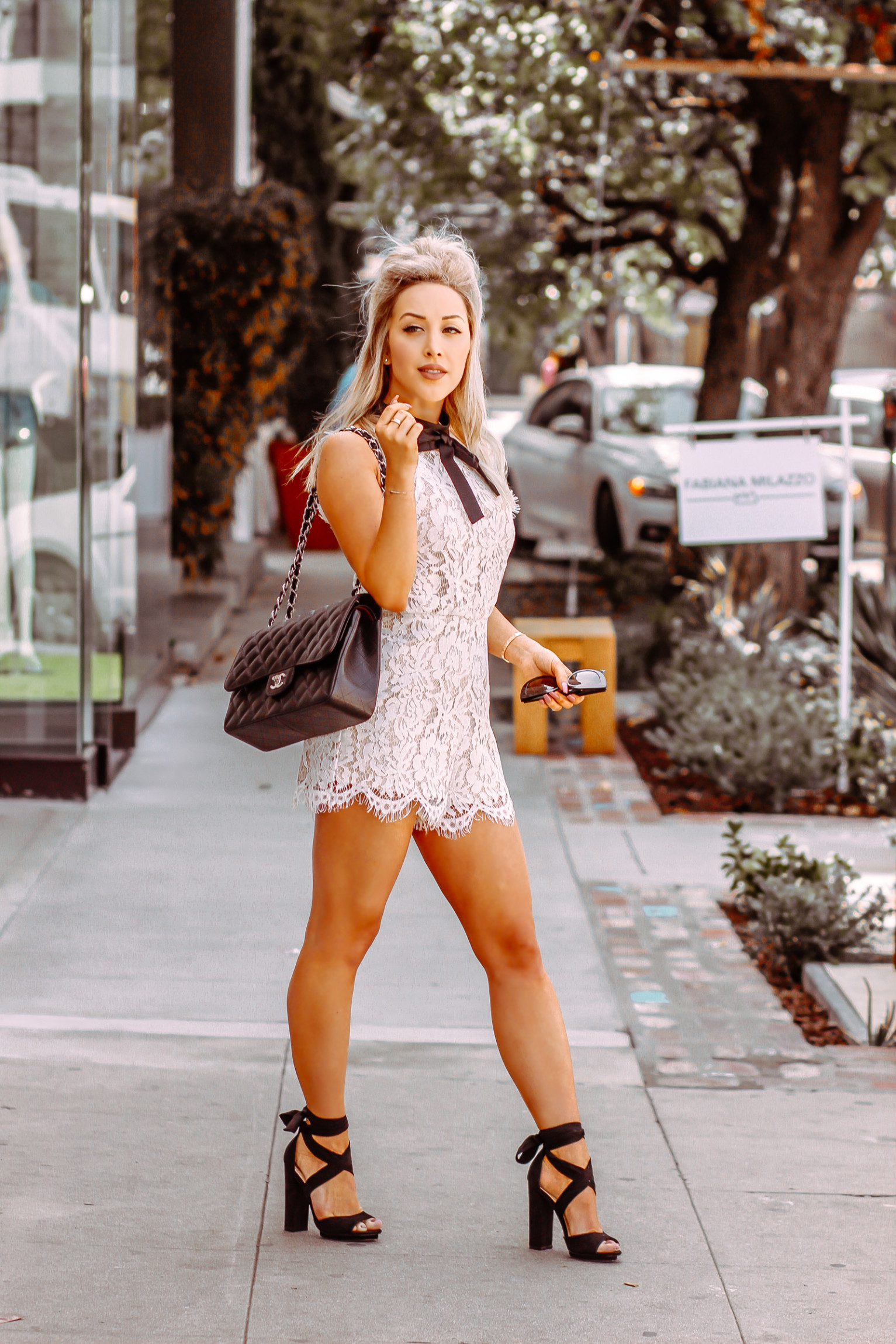 White Lace Romper | Black Quilted Chanel Bag | Bridal Shower Outfit Inspo | Blondie in the City by Hayley Larue