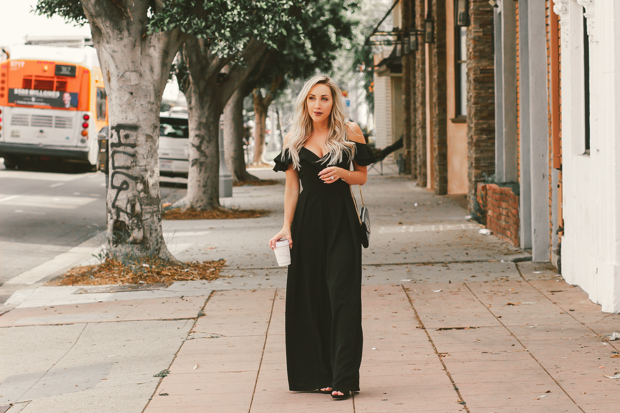 Black Ruffle Off The Shoulder Jumpsuit | Black YSL Bag | Blondie in the City by Hayley Larue