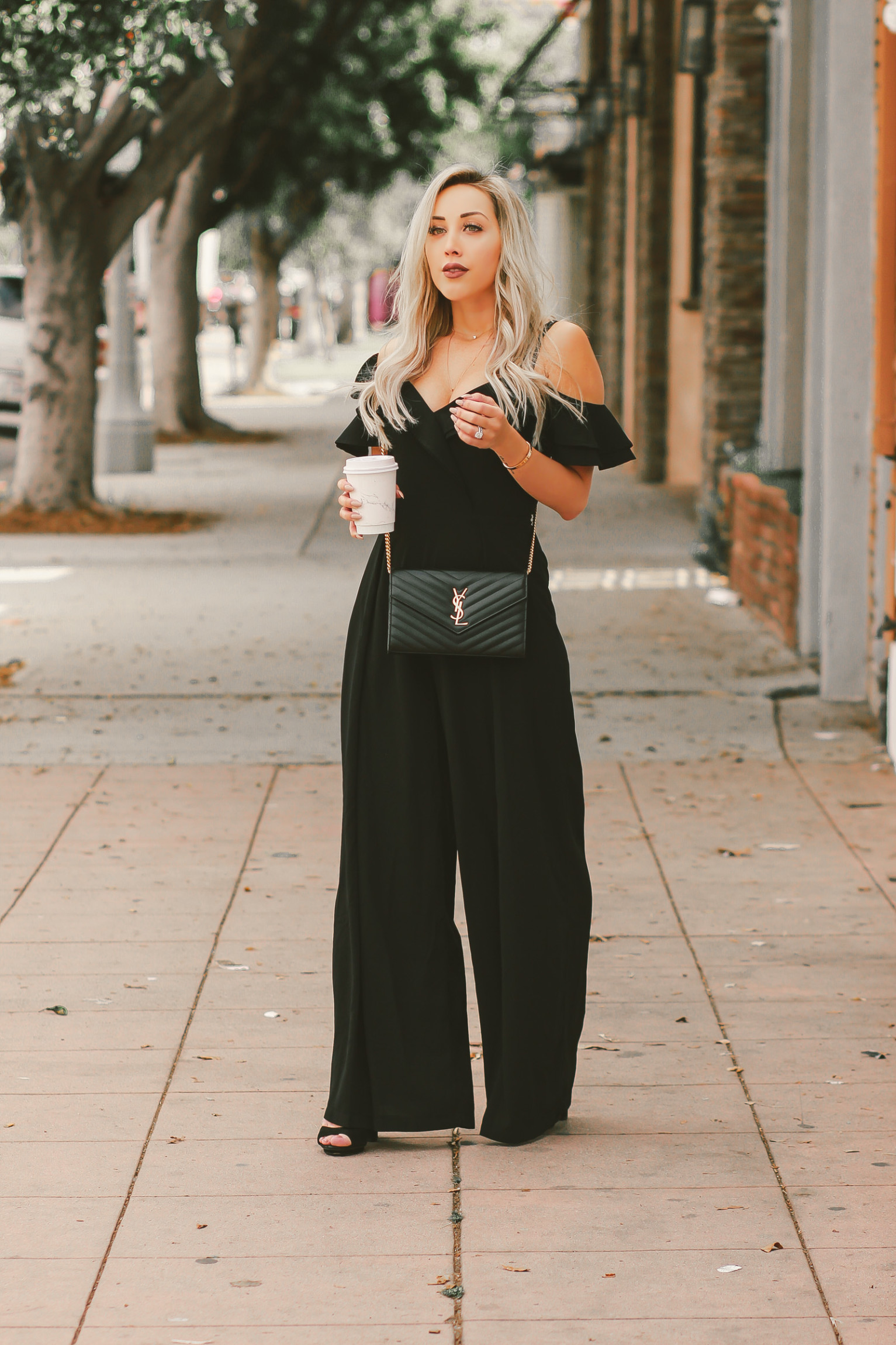 Black Ruffle Off The Shoulder Jumpsuit | Black YSL Bag | Blondie in the City by Hayley Larue