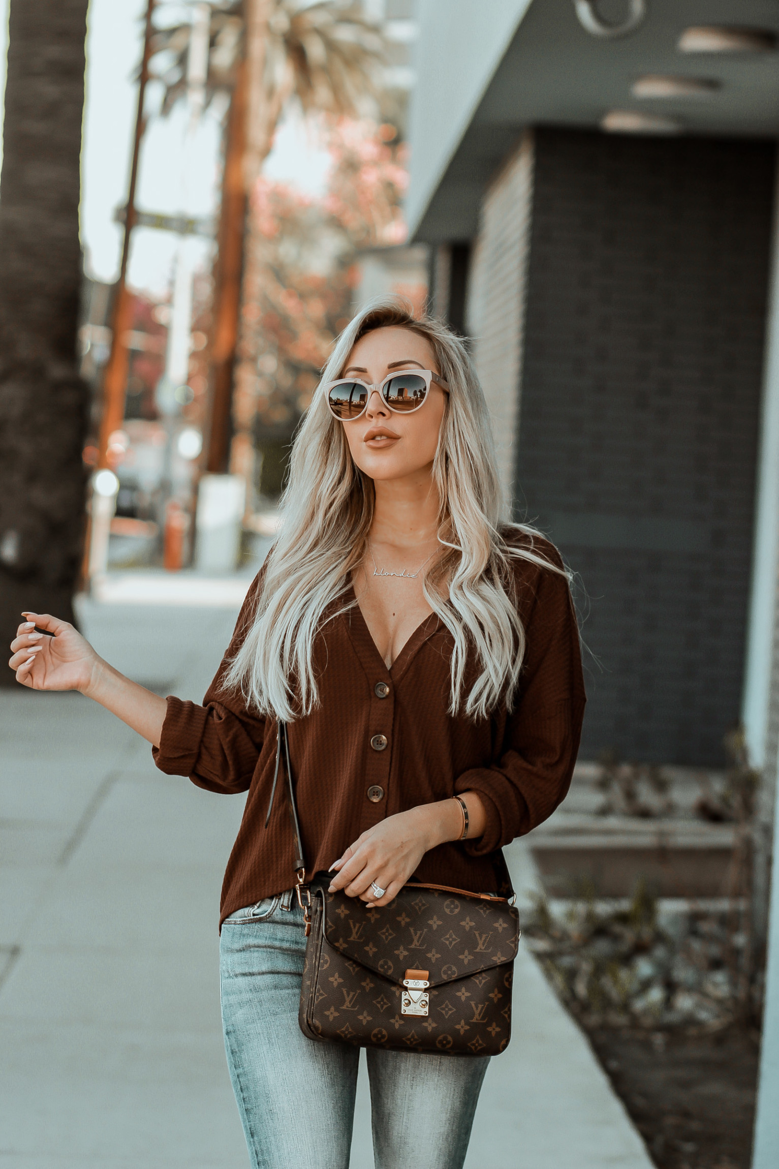 Brown Button Sweater for Fall | Fall Vibes | Distressed Jeans | Louis Vuitton Pochette Metis | Fall Fashion inspo | Blondie in the City by Hayley Larue