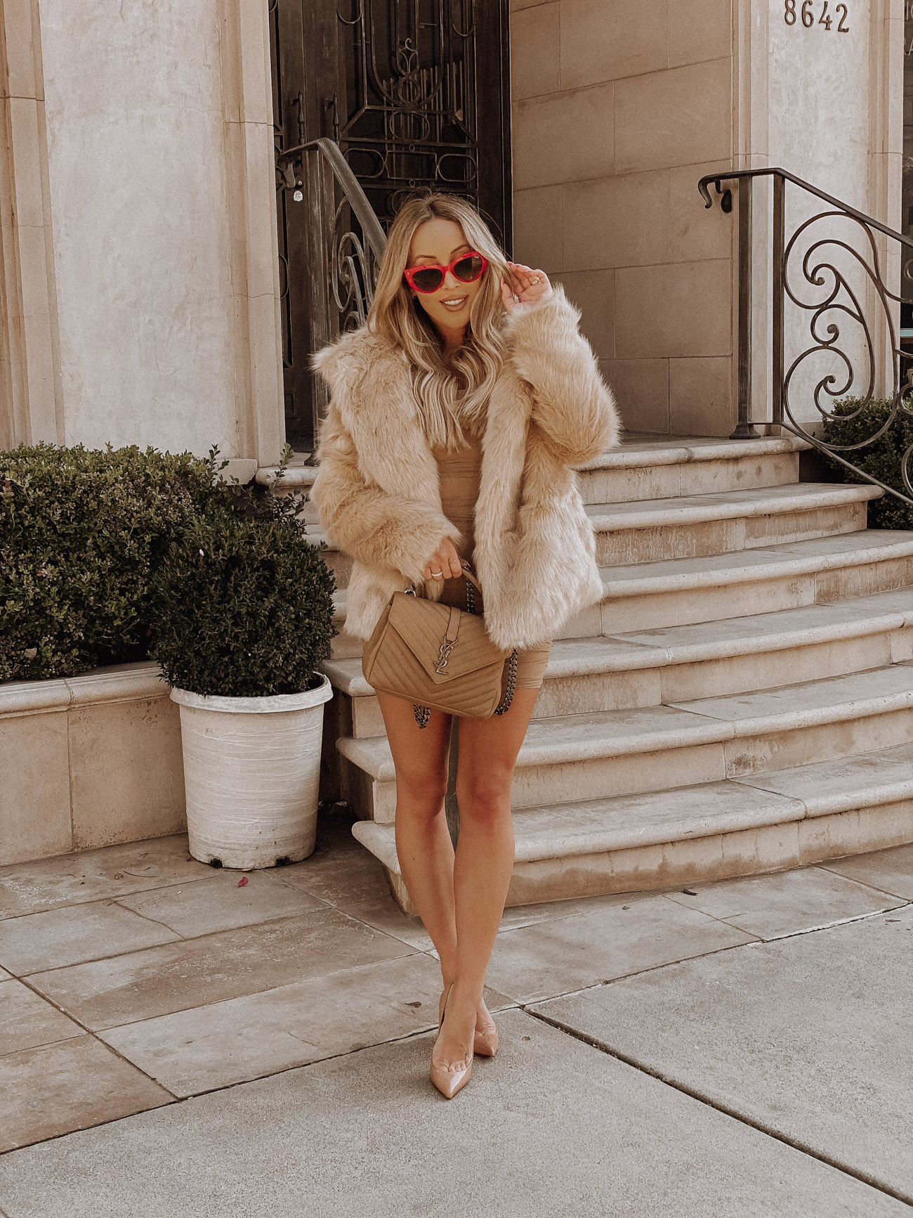 A Red Statement | Faux Fur Coat | Medium YSL College Bag | Nude Louboutins | Blondie in the City by Hayley Larue